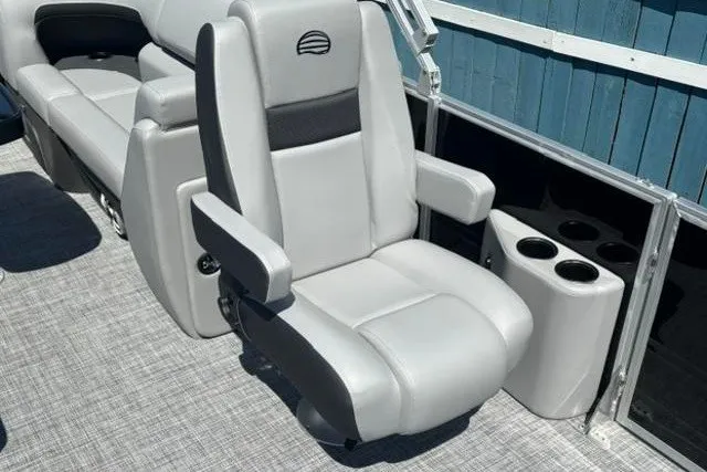 Slide: The Image of 2026 Sun Tracker Party Barge 22 XP3 captain's chair with armrests and cup holders. - 19