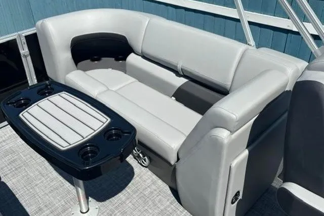 Slide: The Image of 2026 Sun Tracker Party Barge 22 XP3 interior with gray seating and table. - 20