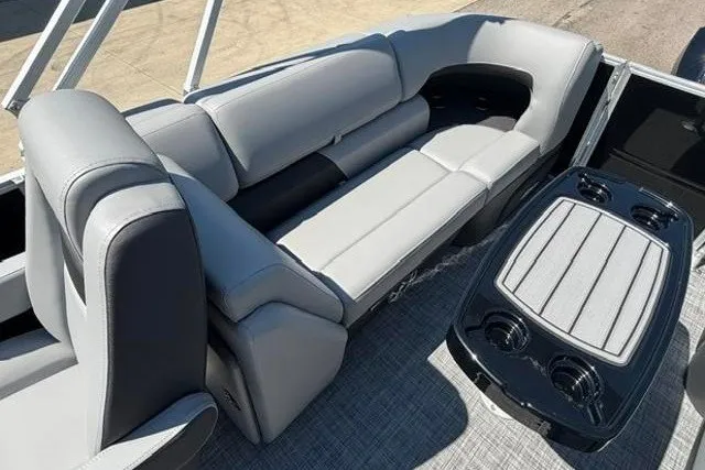 Slide: The Image of 2026 Sun Tracker Party Barge 22 XP3 interior with plush seating and sleek table design. - 22