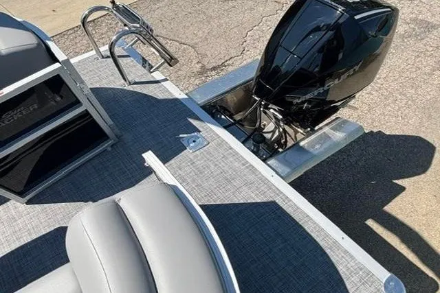 Slide: The Image of 2026 Sun Tracker Party Barge 22 XP3 with sleek seating and powerful outboard motor. - 25