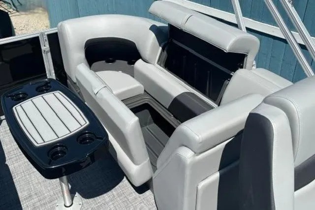 Slide: The Image of 2026 Sun Tracker Party Barge 22 XP3 interior with gray seating and table. - 21