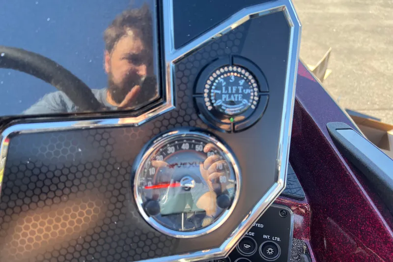 Slide: The Image of Dashboard of a 2026 Vexus VXs20 boat with lift plate control and speedometer. - 16
