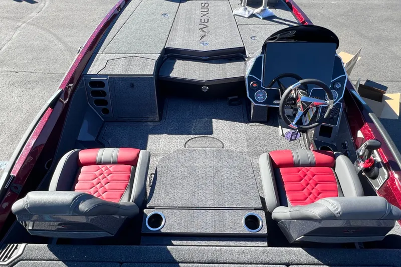Slide: The Image of 2026 Vexus VXs20 boat interior with red and gray seats, modern dashboard, and steering wheel. - 13
