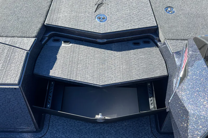 Slide: The Image of 2026 Vexus VXs20 boat deck with open storage compartment, textured surface. - 20