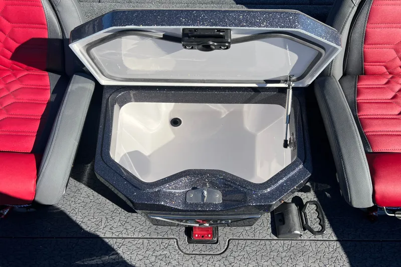 Slide: The Image of Open storage compartment in 2026 Vexus VXs20 boat, flanked by red seats. - 21