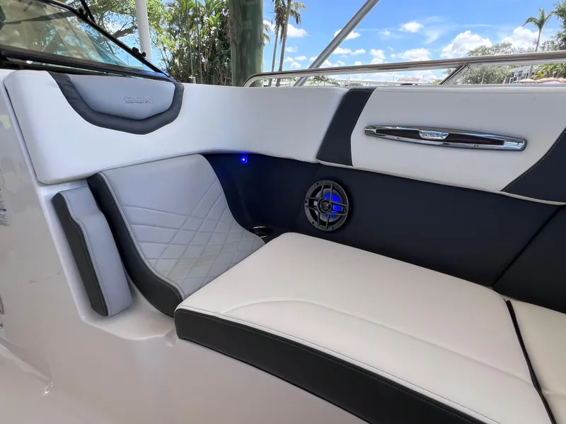 Slide: The Image of 2022 Chaparral 267 SSX OB boat interior with luxurious seating and speaker system. - 30