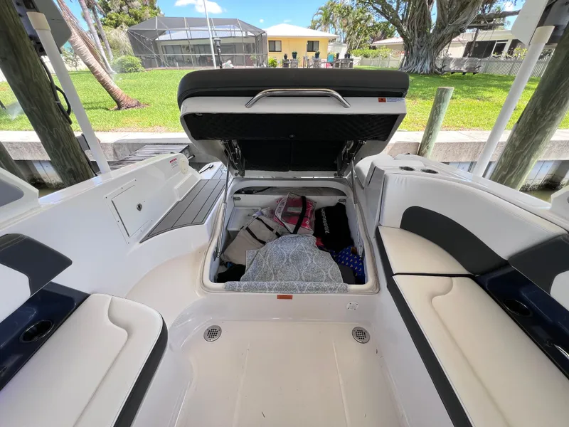 Slide: The Image of 2022 Chaparral 267 SSX OB boat interior with open storage compartment. - 14