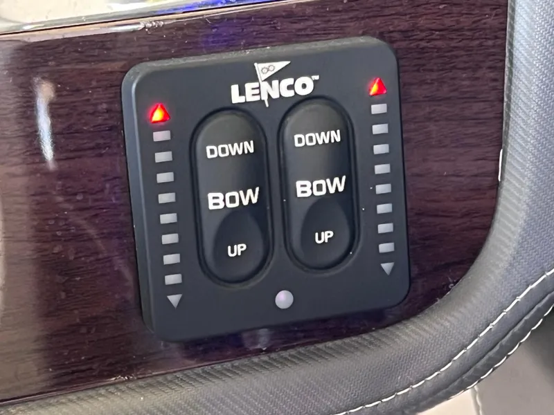 Slide: The Image of Lenco trim tab control panel on 2022 Chaparral 267 SSX OB boat dashboard. - 44