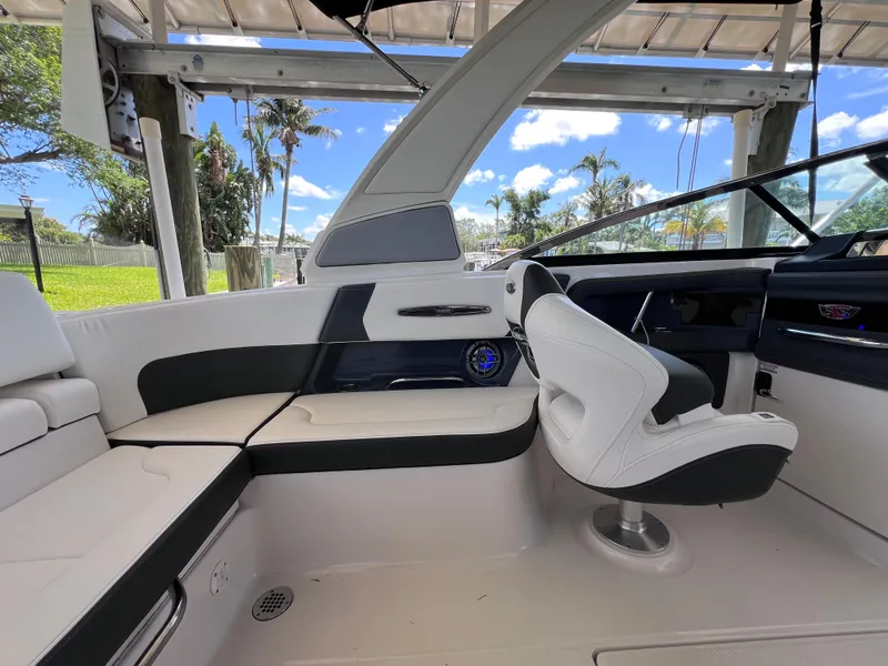Slide: The Image of Interior of 2022 Chaparral 267 SSX OB boat with sleek seating and modern design. - 17