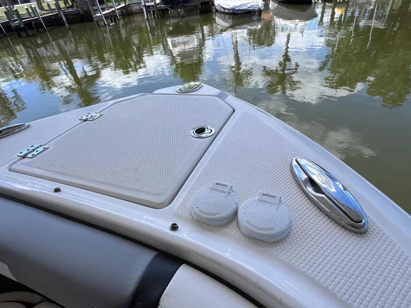 Slide: The Image of 2022 Chaparral 267 SSX OB boat deck with water reflection. - 36