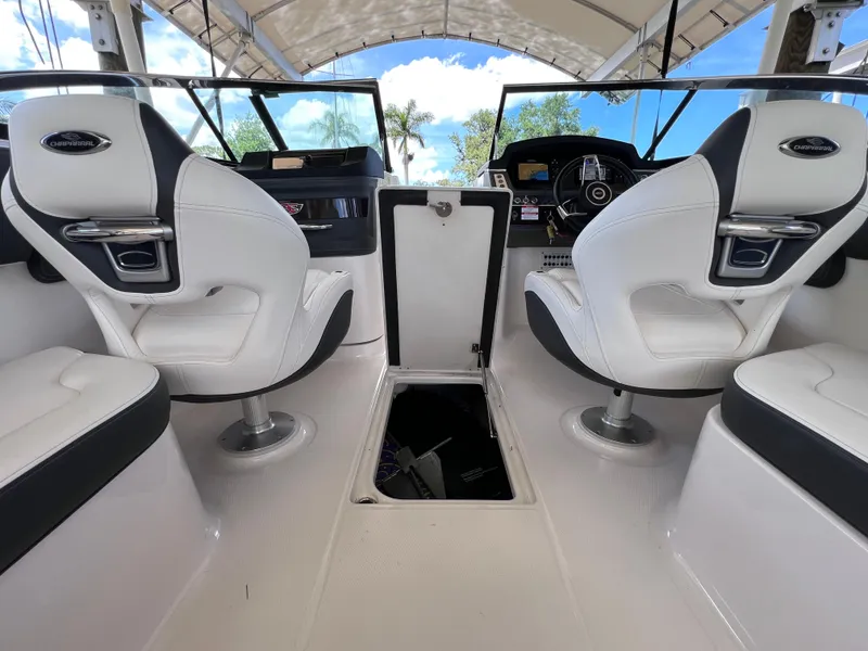 Slide: The Image of The image shows the cockpit of a 2022 Chaparral 267 SSX OB with white seats. - 51