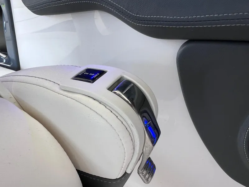 Slide: The Image of 2022 Chaparral 267 SSX OB throttle control with sleek design and blue LED indicators. - 24