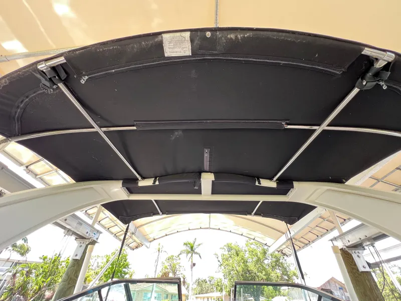 Slide: The Image of 2022 Chaparral 267 SSX OB boat canopy under view with metal supports. - 49