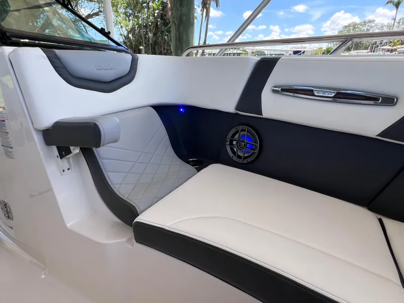 Slide: The Image of 2022 Chaparral 267 SSX OB boat interior with luxurious seating and speaker system. - 31