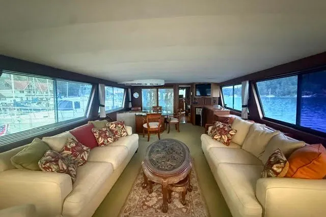 Slide: The Image of Luxurious interior of 1987 Hatteras 72 Motor Yacht with elegant seating and large windows. - 4