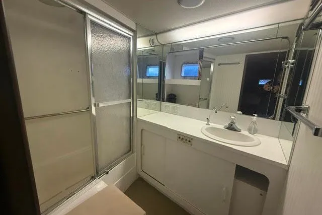 Slide: The Image of Bathroom interior of 1987 Hatteras 72 Motor Yacht with shower and vanity. - 11