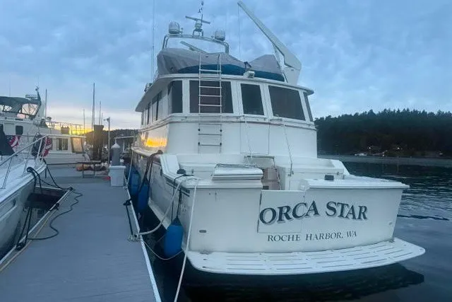Slide: The Image of 1987 Hatteras 72 Motor Yacht docked at Roche Harbor, WA, named "Orca Star." - 0