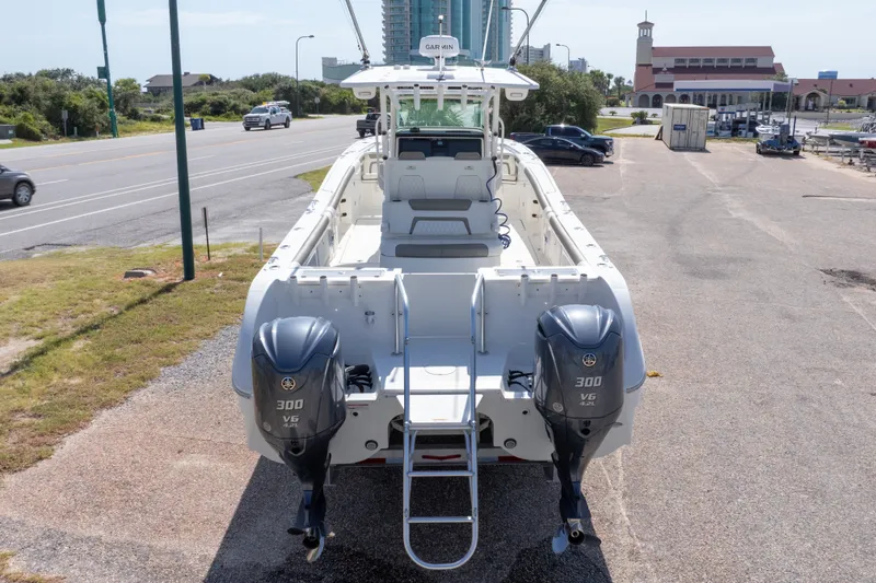 Slide: The Image of 2022 World Cat 325 CC boat with twin Yamaha 300 V6 engines, parked on a lot. - 69
