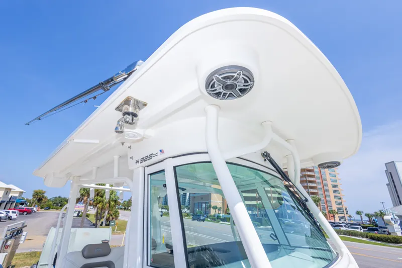 Slide: The Image of 2022 World Cat 325 CC boat with sleek design and modern features, docked outdoors. - 46