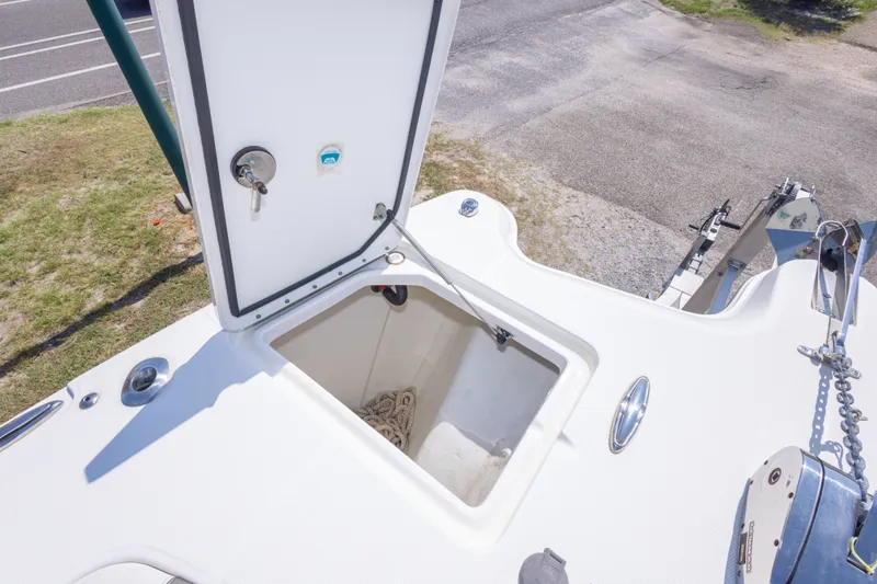 Slide: The Image of Open storage compartment on 2022 World Cat 325 CC boat deck. - 40
