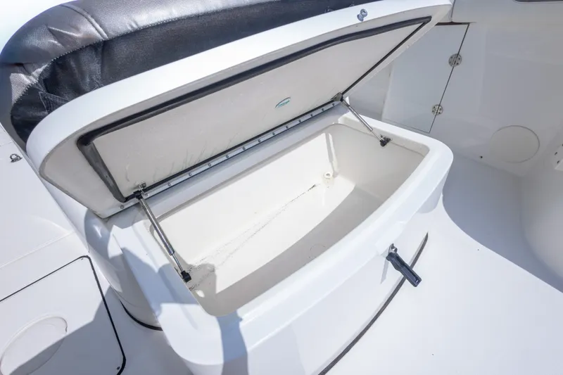 Slide: The Image of Open storage compartment on 2022 World Cat 325 CC boat, showcasing spacious interior. - 41