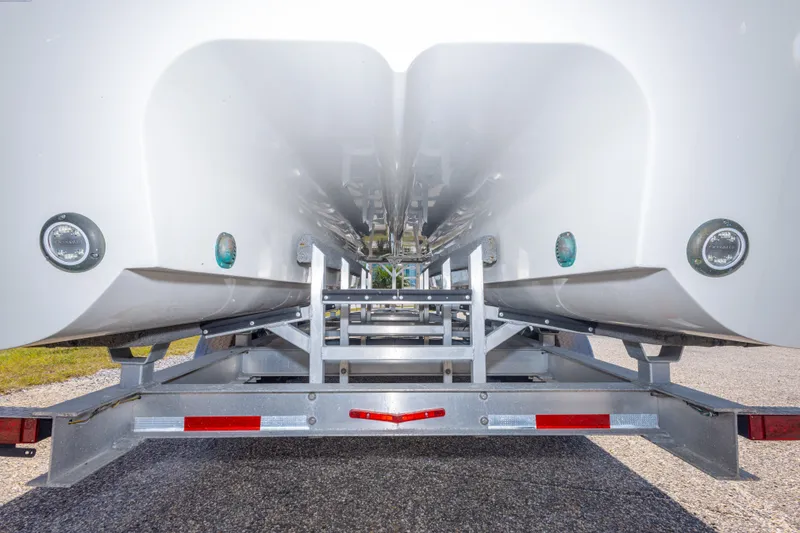 Slide: The Image of 2022 World Cat 325 CC catamaran hull on trailer, showcasing dual hull design. - 63