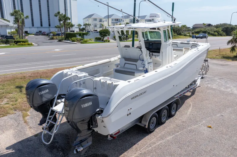 Slide: The Image of 2022 World Cat 325 CC boat with twin Yamaha engines on a trailer. - 68