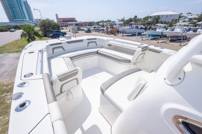 Slide: The Image of 2022 World Cat 325 CC boat interior with spacious seating and modern design. - 34
