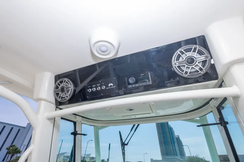 Slide: The Image of 2022 World Cat 325 CC boat interior with speakers and control panel. - 31