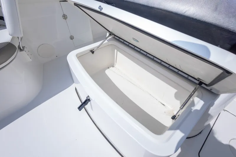 Slide: The Image of Open storage compartment on 2022 World Cat 325 CC boat, showcasing spacious interior. - 42
