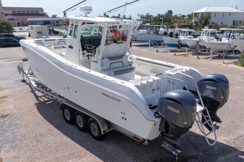 Slide: The Image of 2022 World Cat 325 CC boat with twin Yamaha engines on a trailer. - 70