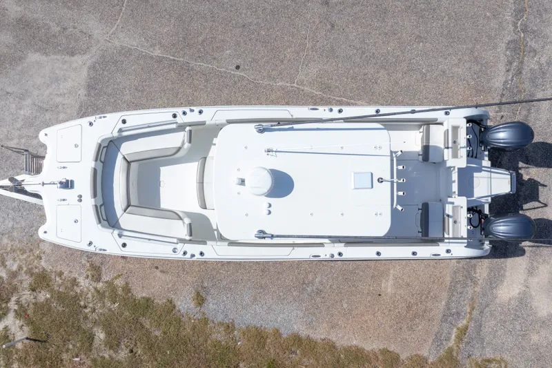 Slide: The Image of Aerial view of 2022 World Cat 325 CC boat on concrete surface. - 6