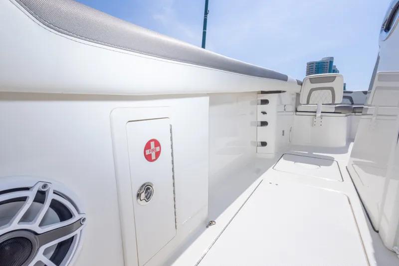 Slide: The Image of 2022 World Cat 325 CC boat interior with fire safety compartment and seating. - 48