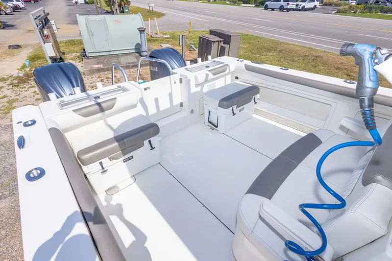 Slide: The Image of 2022 World Cat 325 CC boat interior with seating and storage compartments. - 54