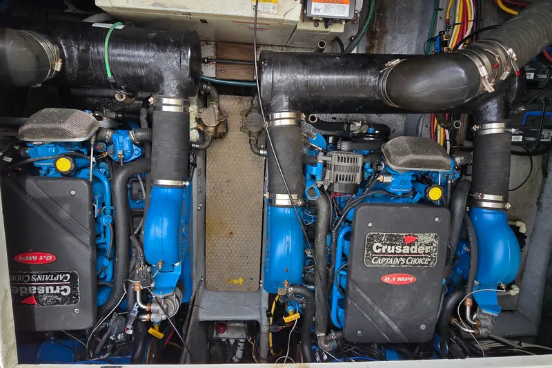 Slide: The Image of Engine room of a 2001 Silverton 330 Sport Bridge with Crusader engines. - 33
