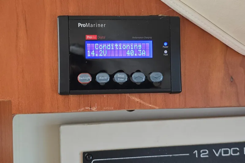 Slide: The Image of ProMariner digital display on 2001 Silverton 330 Sport Bridge, showing voltage and current. - 30