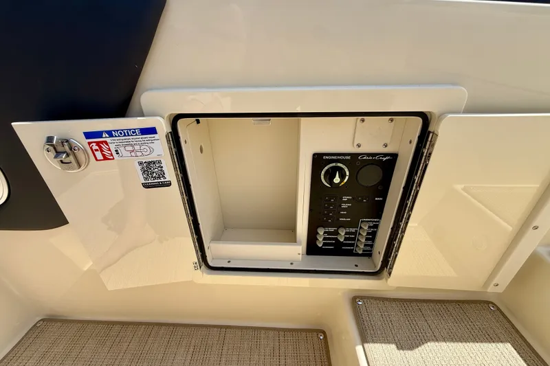 Slide: The Image of Control panel of 2027 Chris-Craft Sportster 28 OB boat, featuring enginehouse controls. - 17
