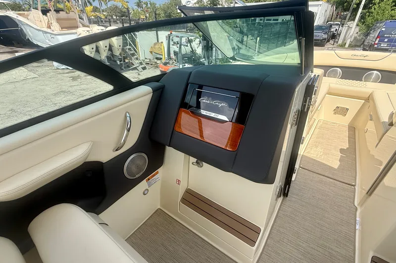 Slide: The Image of 2027 Chris-Craft Sportster 28 OB interior with elegant seating and dashboard details. - 23