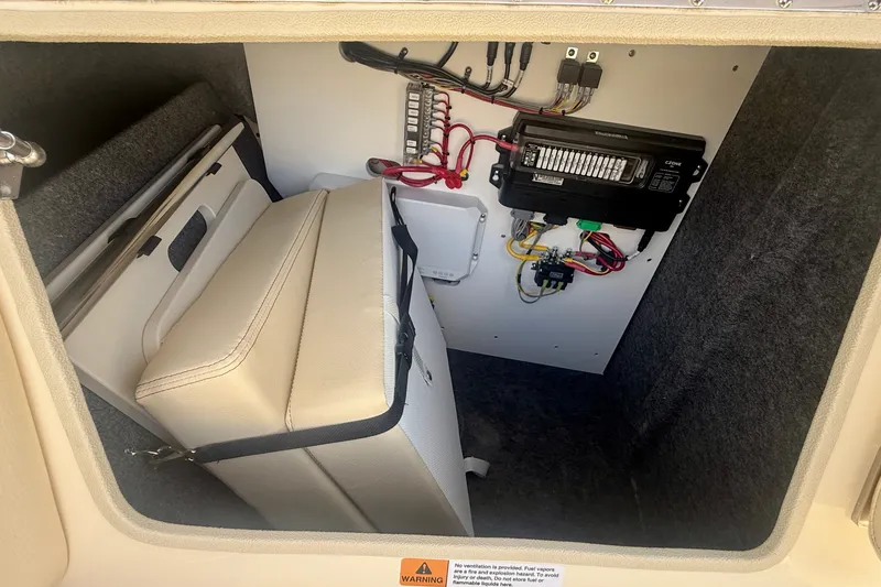Slide: The Image of Electrical compartment of 2027 Chris-Craft Sportster 28 OB with wiring and storage. - 26