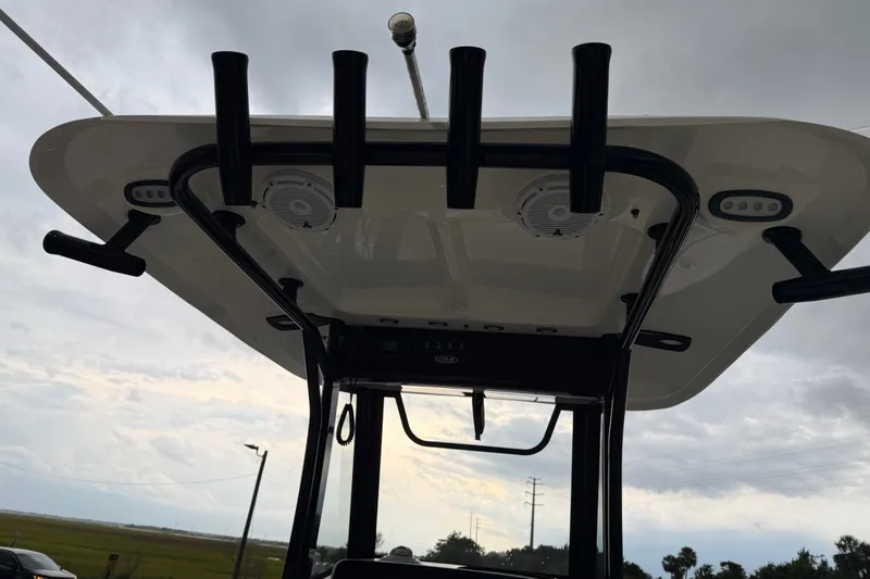 Slide: The Image of 2022 Sea Hunt Ultra 275SE boat's T-top with rod holders and speakers. - 3
