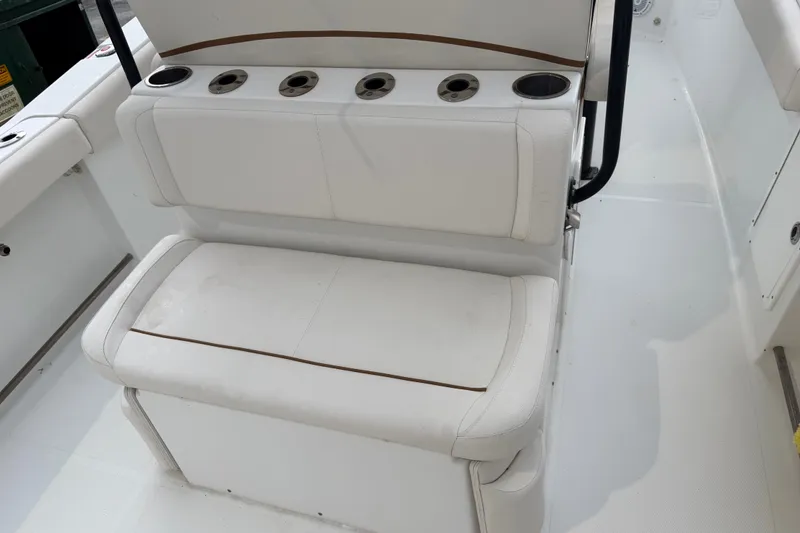 Slide: The Image of 2022 Sea Hunt Ultra 275SE boat seating with integrated cup holders. - 16
