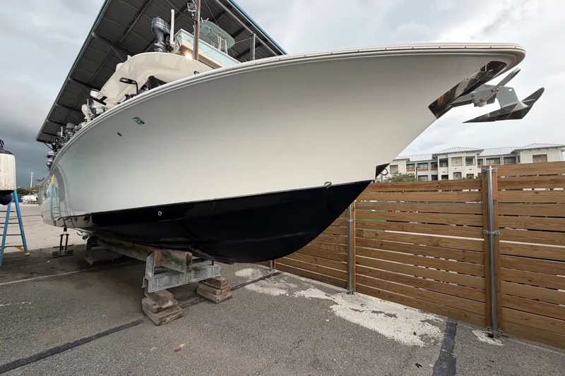 Slide: The Image of 2022 Sea Hunt Ultra 275SE boat on dry dock, viewed from the bow. - 26
