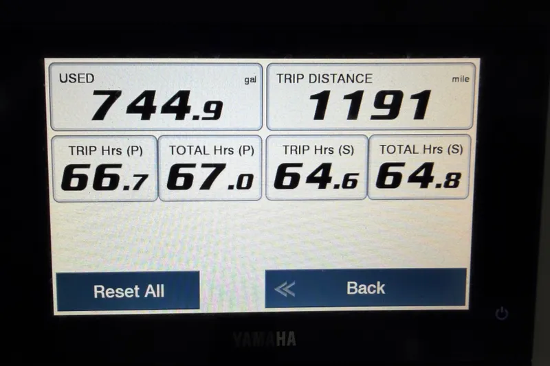 Slide: The Image of Display screen showing fuel usage and trip data for 2022 Sea Hunt Ultra 275SE. - 12
