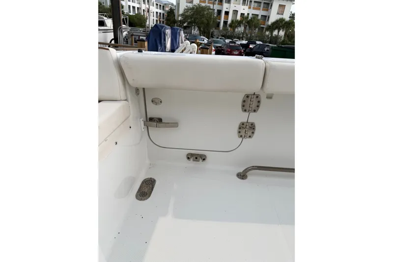 Slide: The Image of Interior view of a 2022 Sea Hunt Ultra 275SE boat, showcasing seating and hardware. - 7