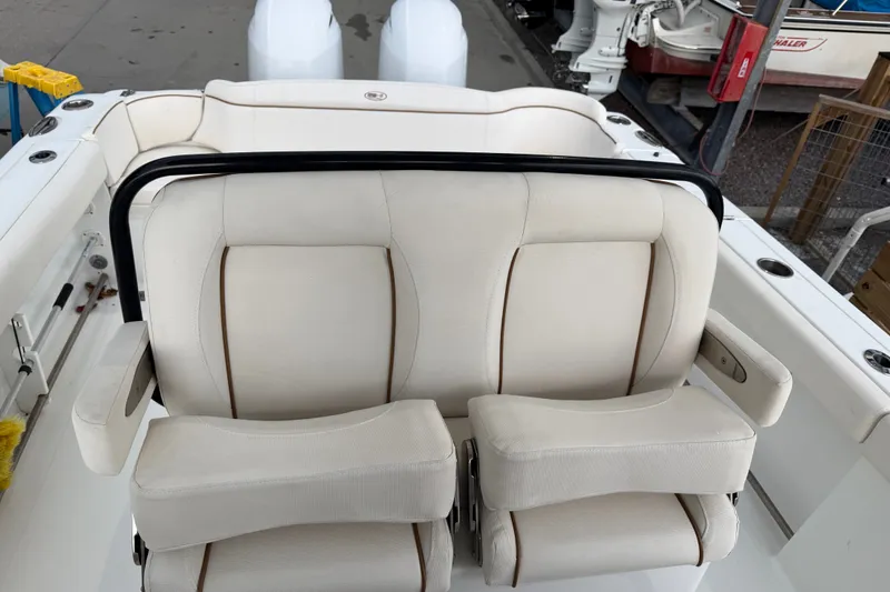 Slide: The Image of Luxury seating on a 2022 Sea Hunt Ultra 275SE boat, featuring plush white upholstery. - 24