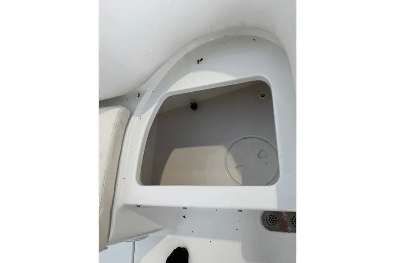 Slide: The Image of Storage compartment on 2022 Sea Hunt Ultra 275SE boat, featuring clean white interior. - 6