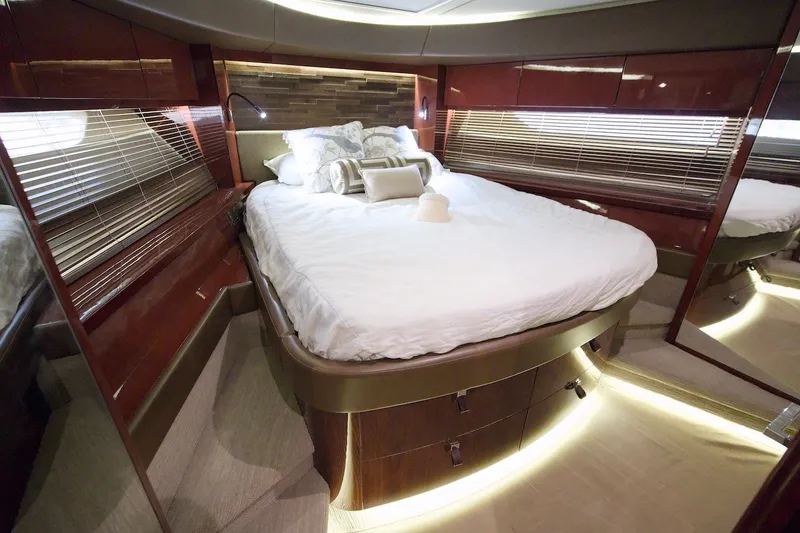 Slide: The Image of Luxurious bedroom interior of 2017 Sea Ray L590 Fly yacht with elegant wood finishes. - 57