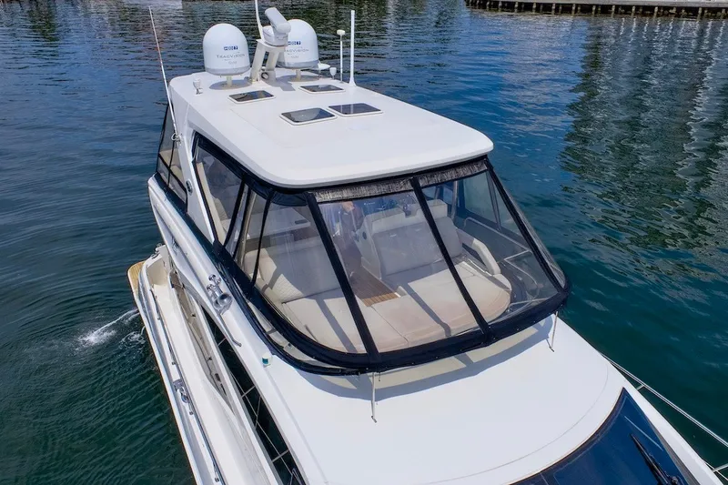 Slide: The Image of 2017 Sea Ray L590 Fly yacht cruising on calm waters. - 13