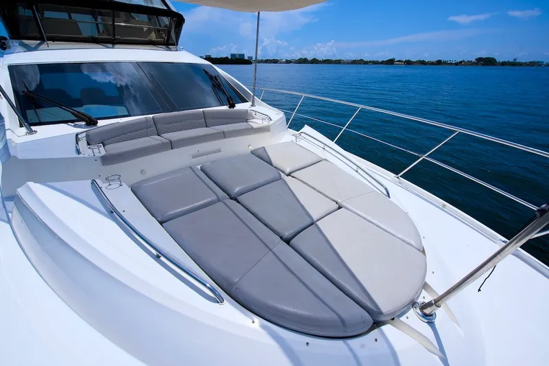 Slide: The Image of 2017 Sea Ray L590 Fly yacht with spacious sunbathing deck on calm waters. - 28