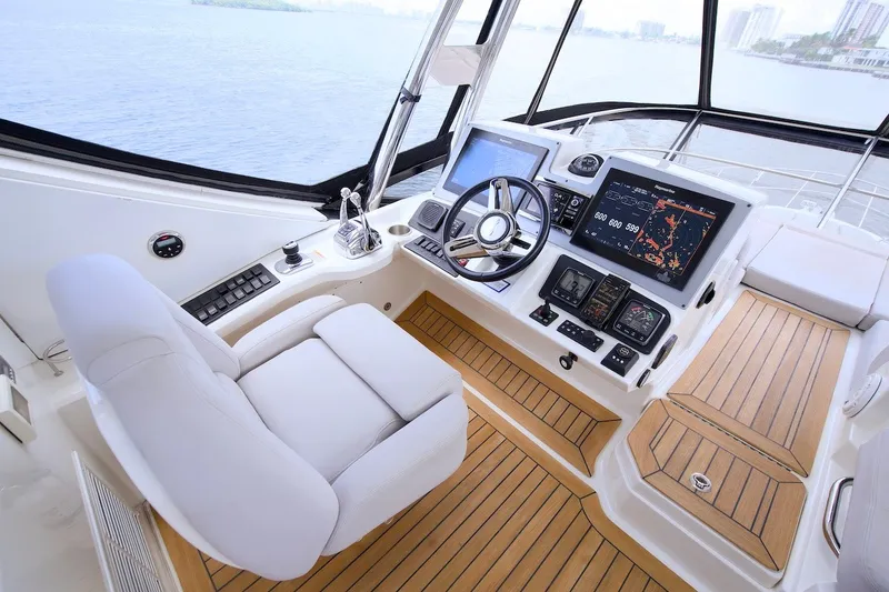 Slide: The Image of Helm of 2017 Sea Ray L590 Fly yacht with modern navigation equipment and luxurious seating. - 35